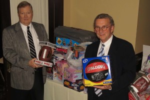 GABB President Greg DeFoor (left) and Board Member Jeff Merry collect toys and other items to donate to the Foster Care Support Foundation.